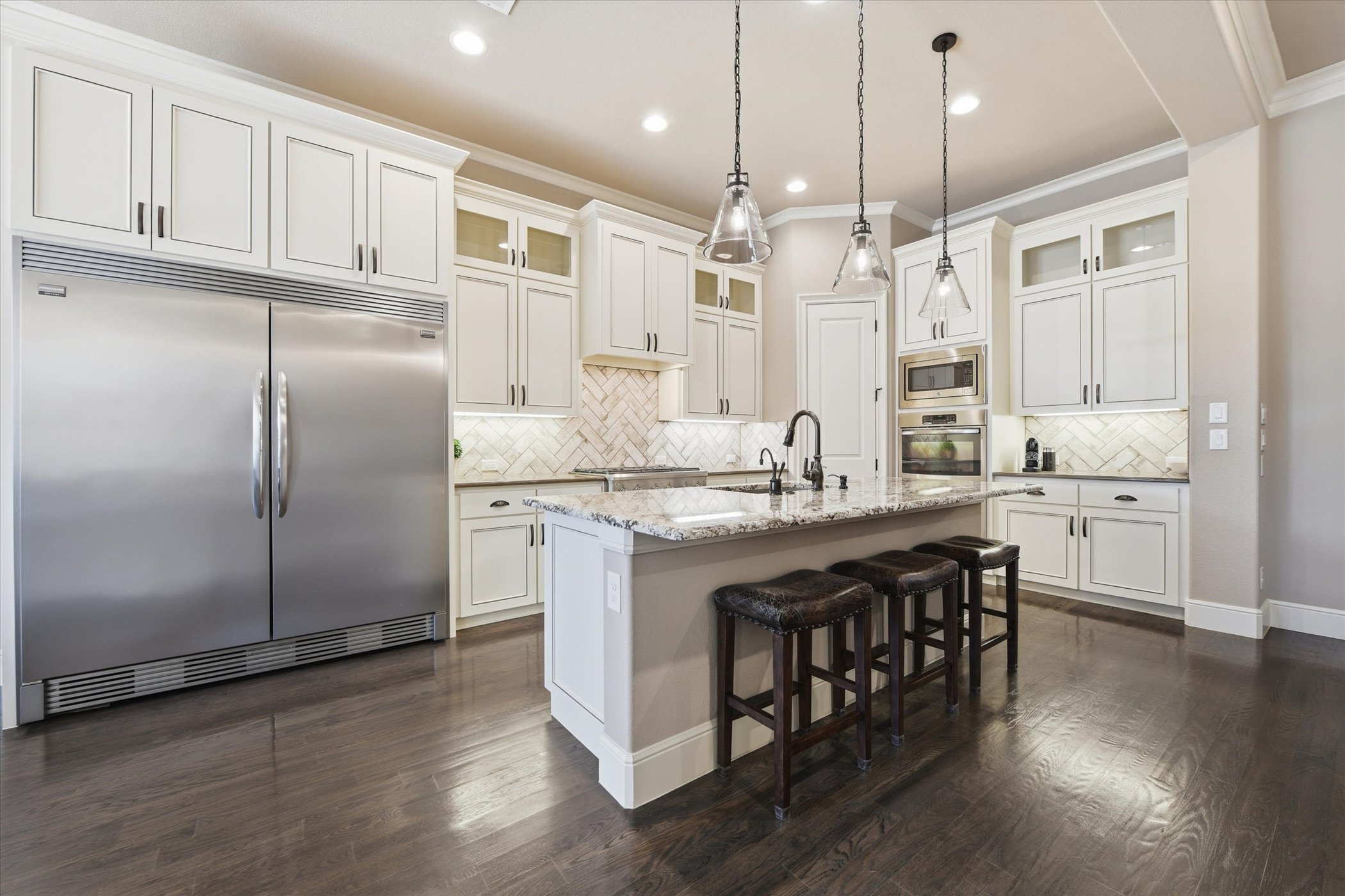Gourmet kitchen with premium appliances and custom cabinetry